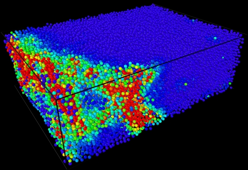 In this snapshot showing a reconstruction of a compression experiment, the red particles indicate hotspots, where atoms are rearranging as a prelude to failure.