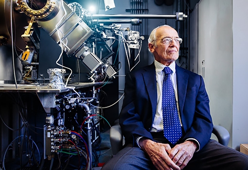 Art Gossard with the molecular beam epitaxy instrument he largely invented.