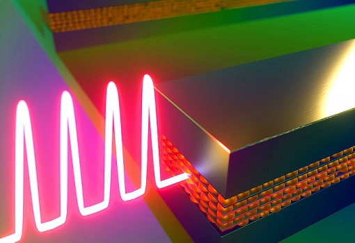 artist rendering of quantum dot-enhanced laser light emitted from silicon chip