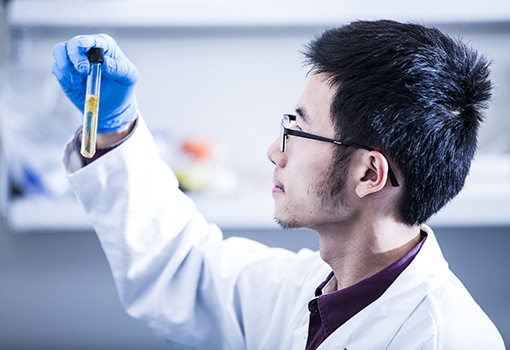 A a graduate student at work in a UCSB lab.