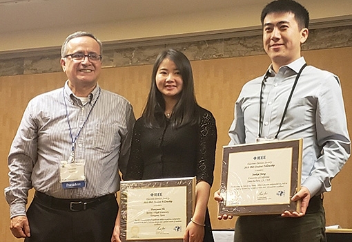 Junkai Jiang receives his award from IEEE EDS president D. Fernando Guarin, along with fellow recipient Yuanyuan Shi, a doctoral student in Spain.