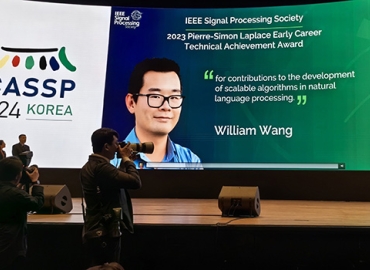 Photo of William Wang at an even recognizing his award.